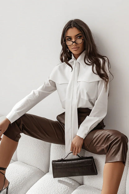 White long-sleeve button-up shirt with pointed collar and front placket