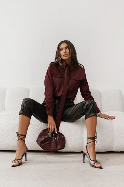 Burgundy long-sleeve button-up shirt with pointed collar and front buttons