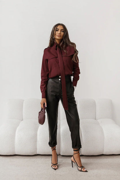 Burgundy long-sleeve button-up shirt with pointed collar and button placket