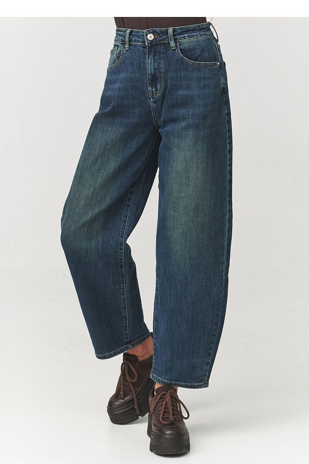 High-waisted vintage indigo jeans with zip fly, button waist, relaxed straight legs