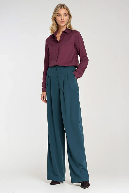 Women’s teal wide-leg trousers with a relaxed fit and wide, straight legs