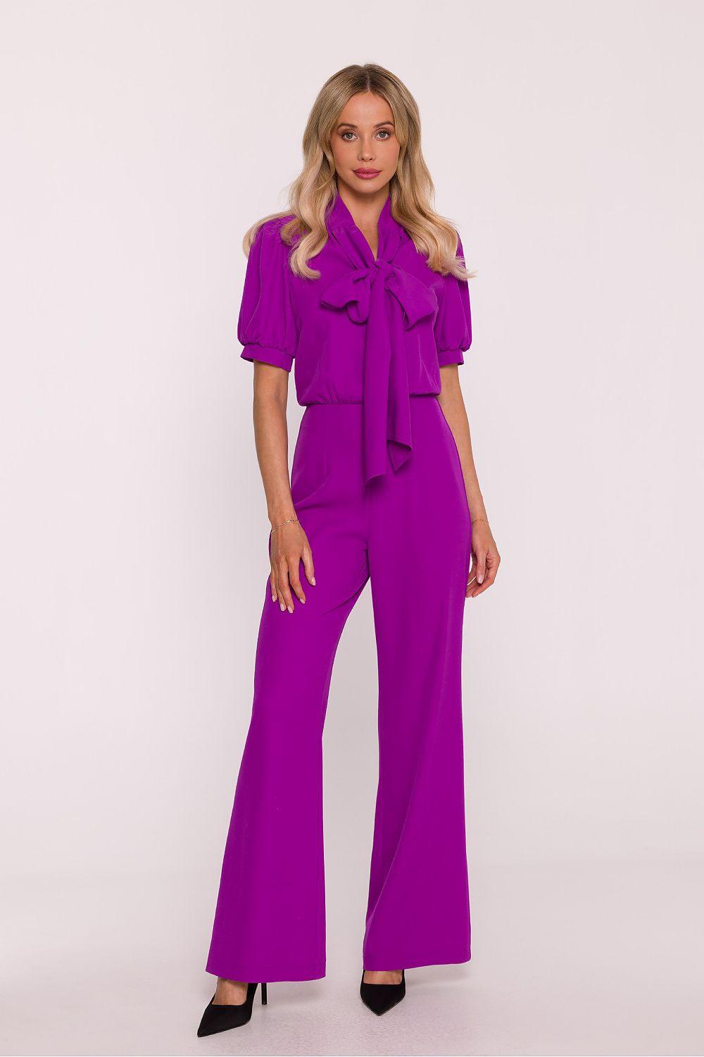 Violet jumpsuit with puff sleeves, ruffle neckline, and wide-leg pants