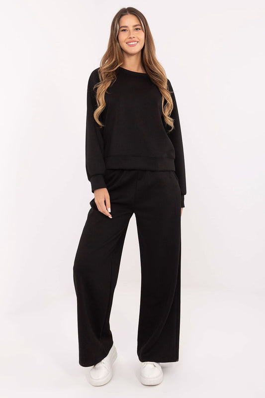 Black knit lounge set with crewneck sweatshirt and wide-leg pants, front view