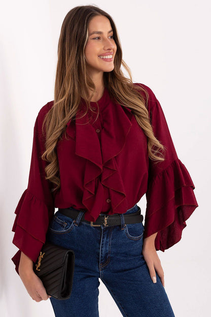 Red long-sleeve shirt with ruffled jabot detail and layered flutter cuffs