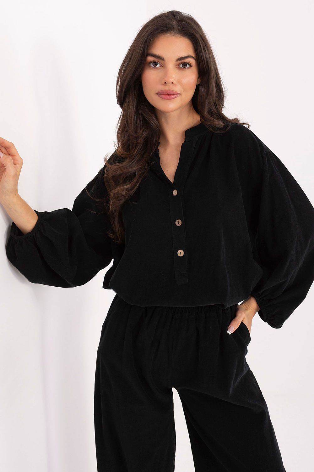 Black blouse with button placket and long balloon sleeves, relaxed fit