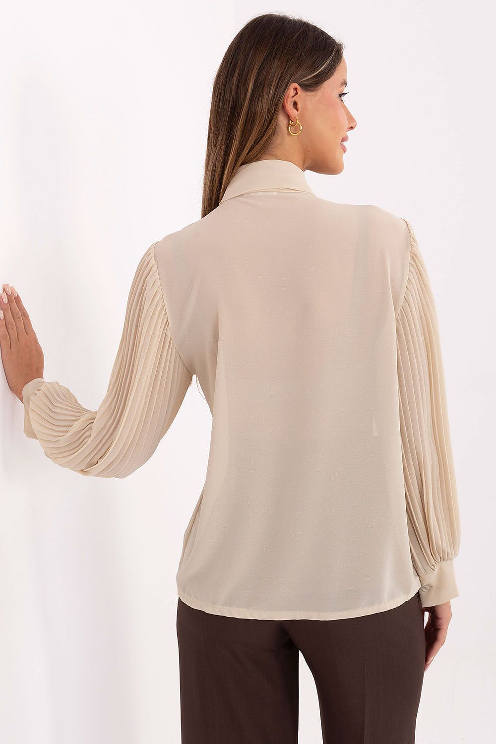Beige pleated long-sleeve shirt with jabot front, shown from the back