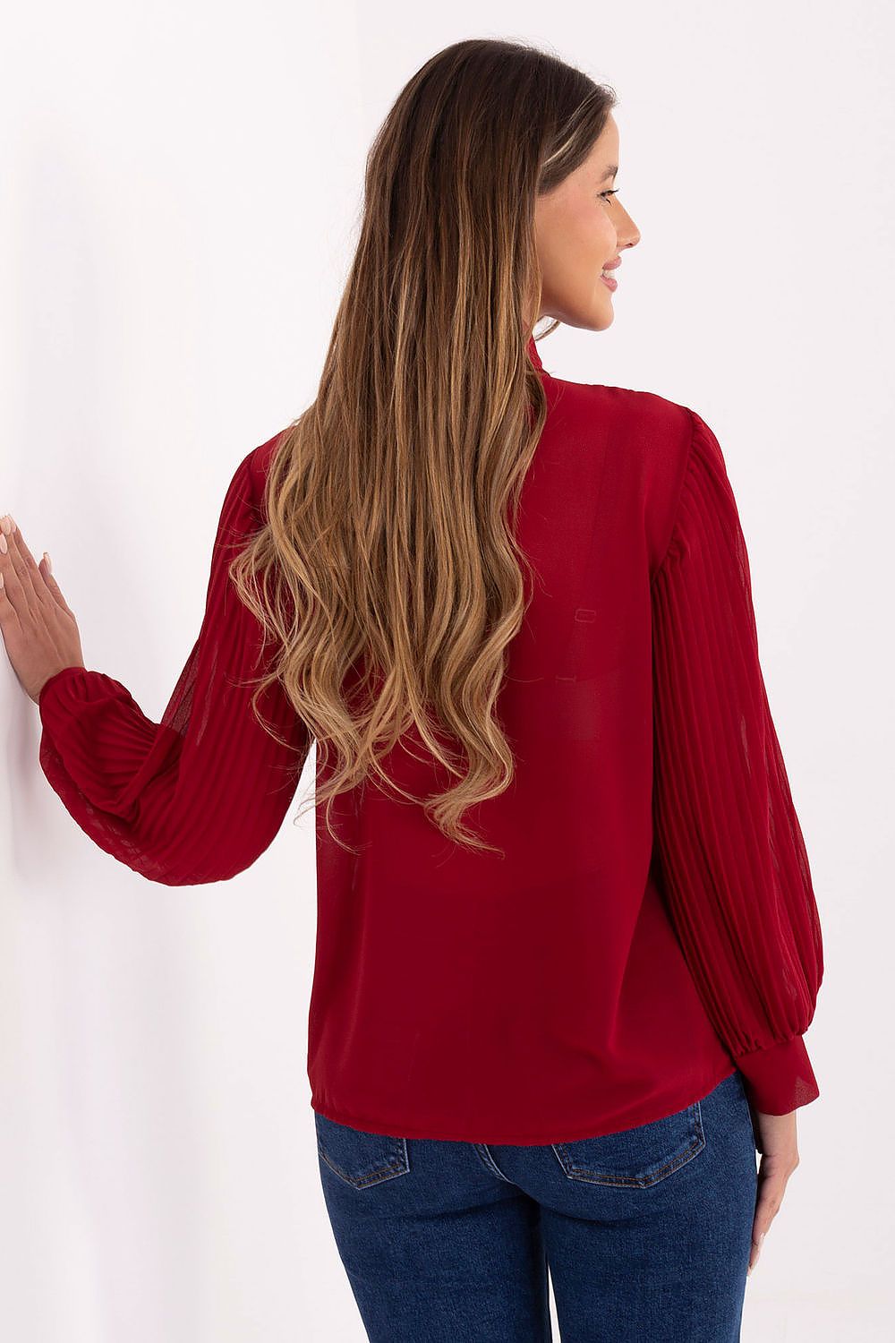 Red pleated long-sleeve shirt with jabot front, shown from the back