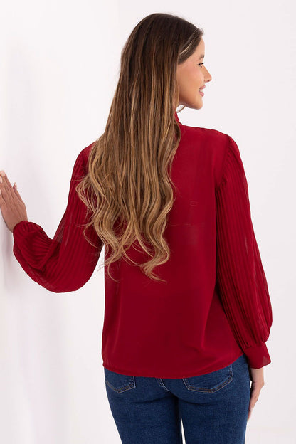 Red pleated long-sleeve shirt with jabot front, shown from the back
