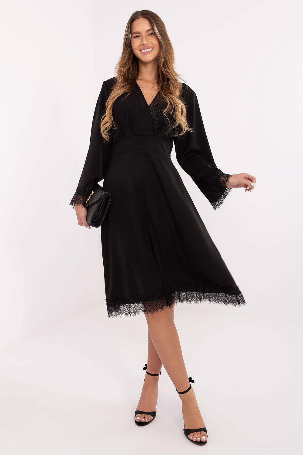 Black lace midi cocktail dress with V-neck and long sleeves, tiered fringe hem.