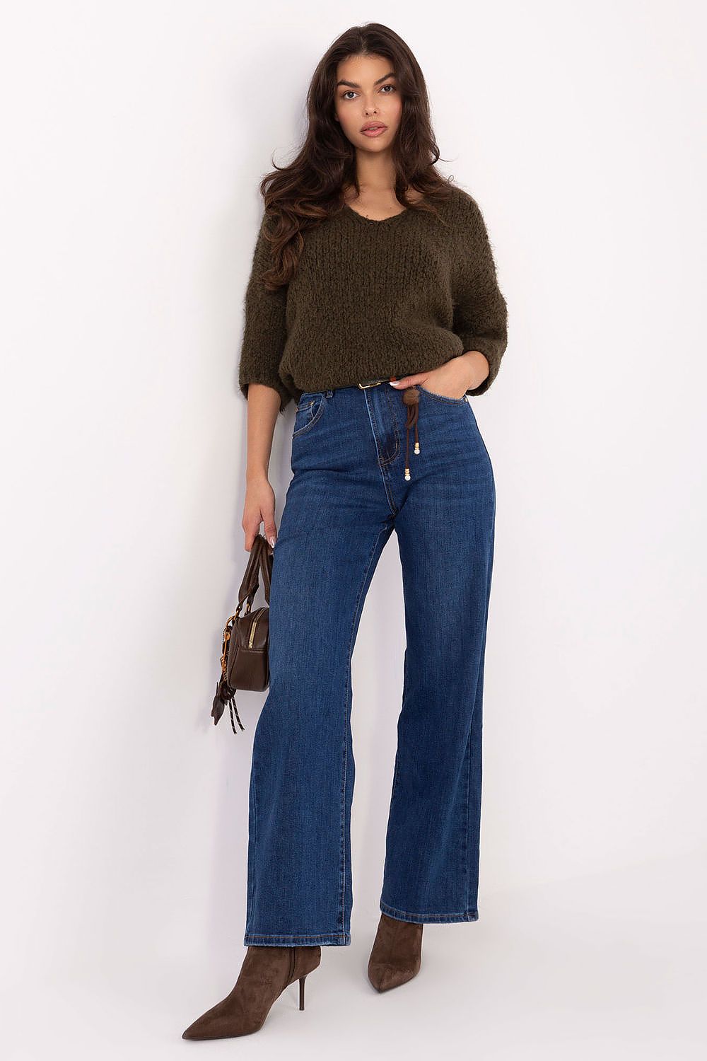 Blue denim jeans with wide-leg flare, belt loops, and button-and-zip fly