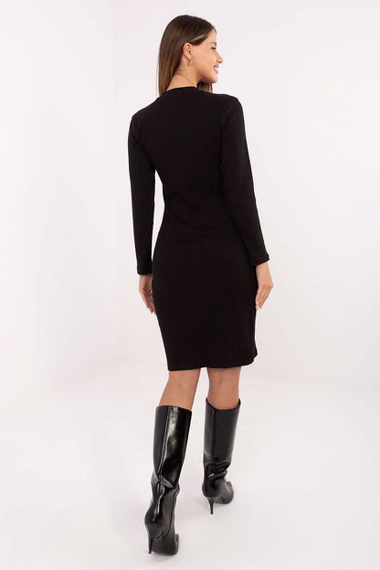 Black ribbed midi daydress, back view with long sleeves and fitted waist