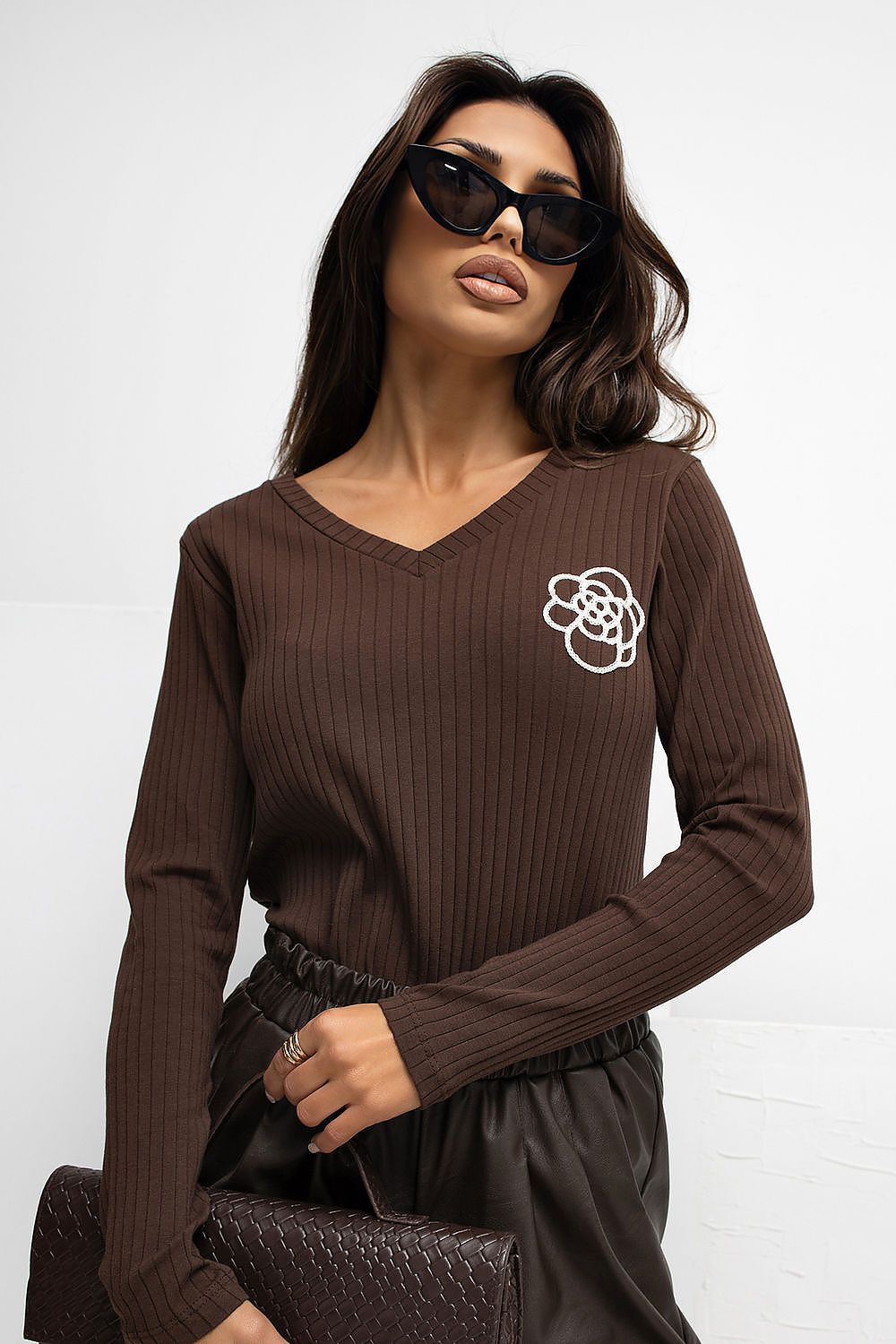 Brown ribbed V-neck blouse with embroidered flower on left chest