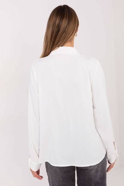 Women's long sleeve white shirt, back view with button cuffs
