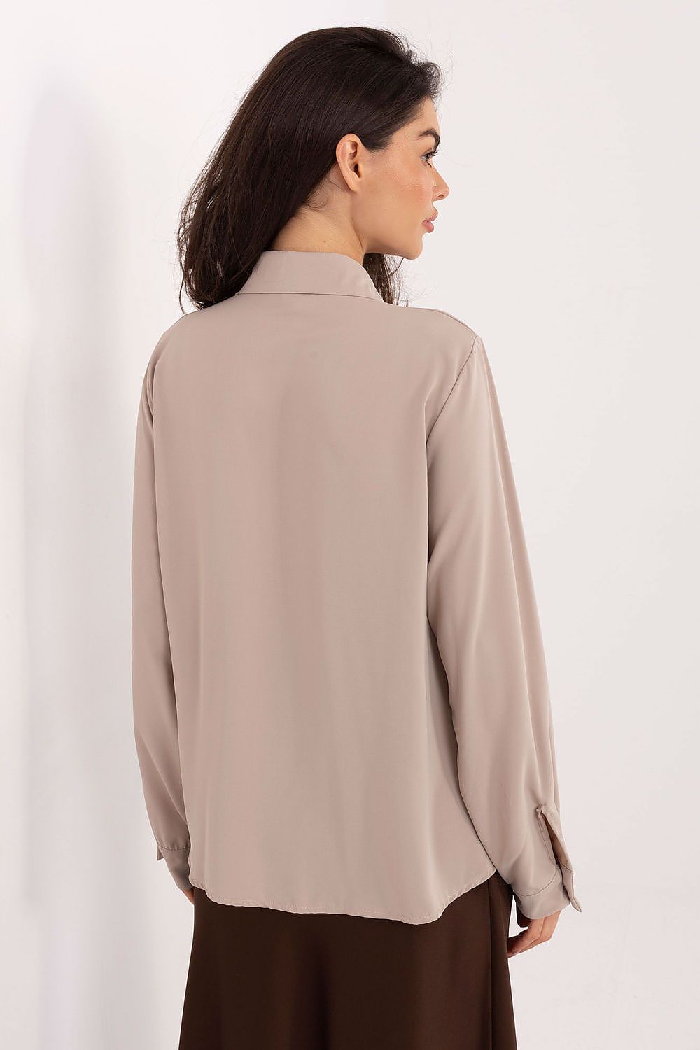 Women's long-sleeve shirt in beige, collared back view with button cuffs