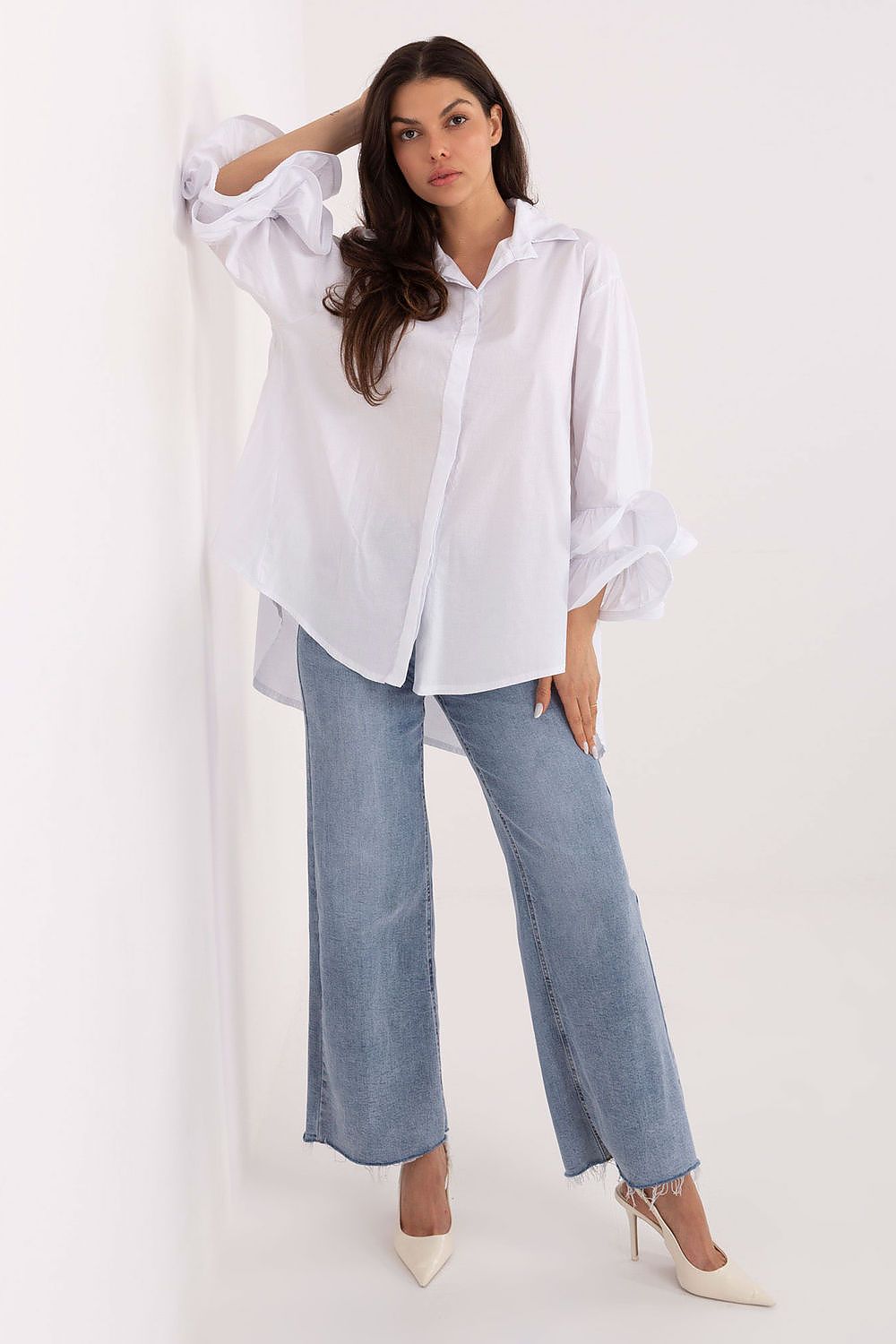 White women’s long-sleeve shirt with button front and frilled cuffs
