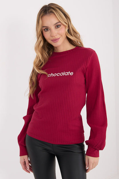 Red long-sleeve blouse with ribbed knit texture and small front embroidery