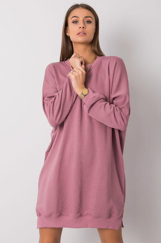 Pink sweatshirt dress with long sleeves, crew neck, and relaxed oversized fit