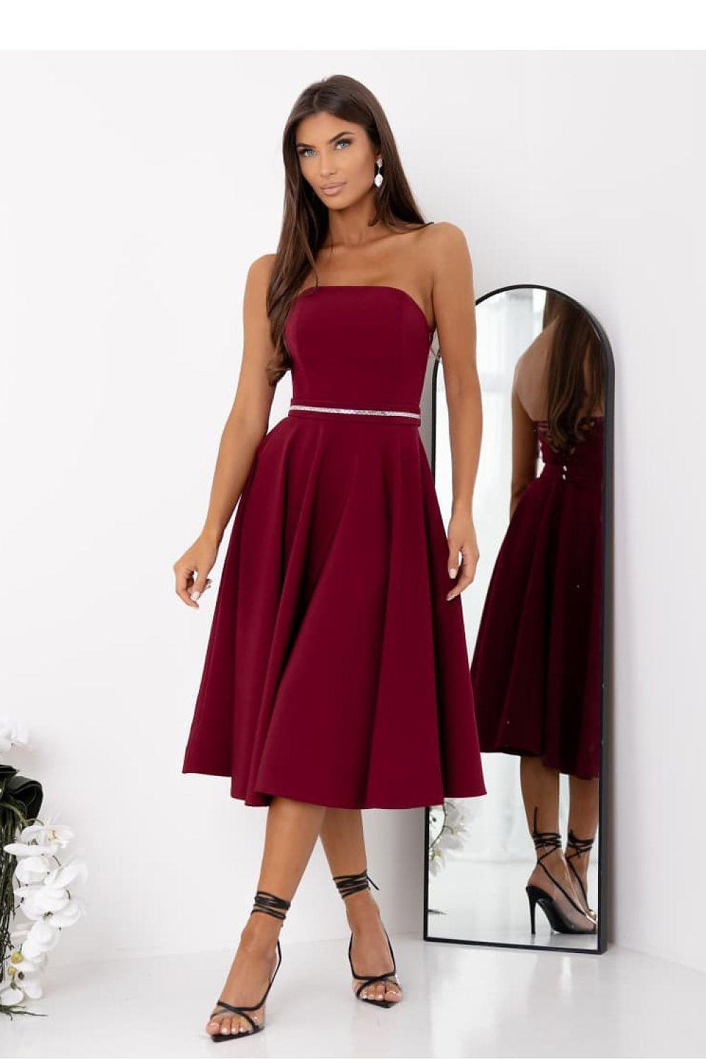 Evening dress, burgundy wide-strap sweetheart bodice with silver belt and pleated skirt.
