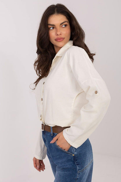 Long-sleeve button-up shirt in white, with pointed collar and button front