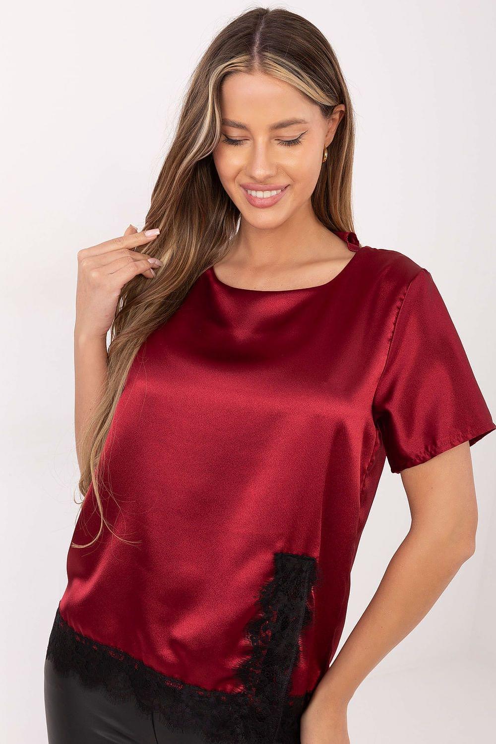 Red satin blouse with short sleeves and black lace trim at the hem