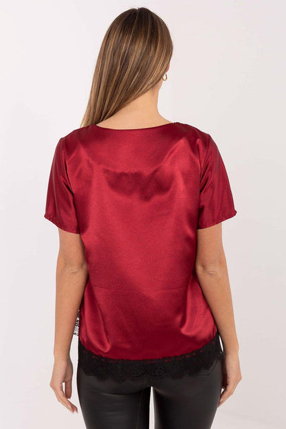Red satin blouse from the back with short sleeves and black lace hem trim