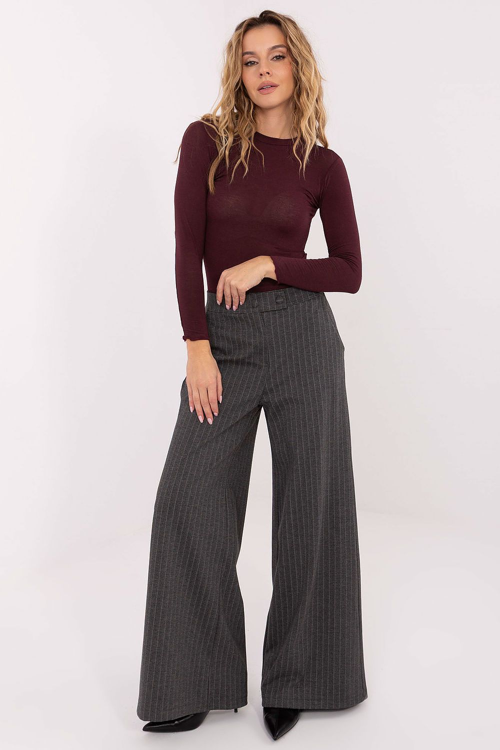 Burgundy long-sleeve blouse with crew neck, fitted sleeves, and straight hem