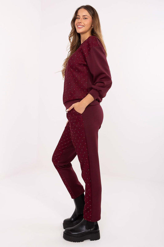 Speckled two-piece loungewear set: pullover hoodie and jogger pants, burgundy, side view.