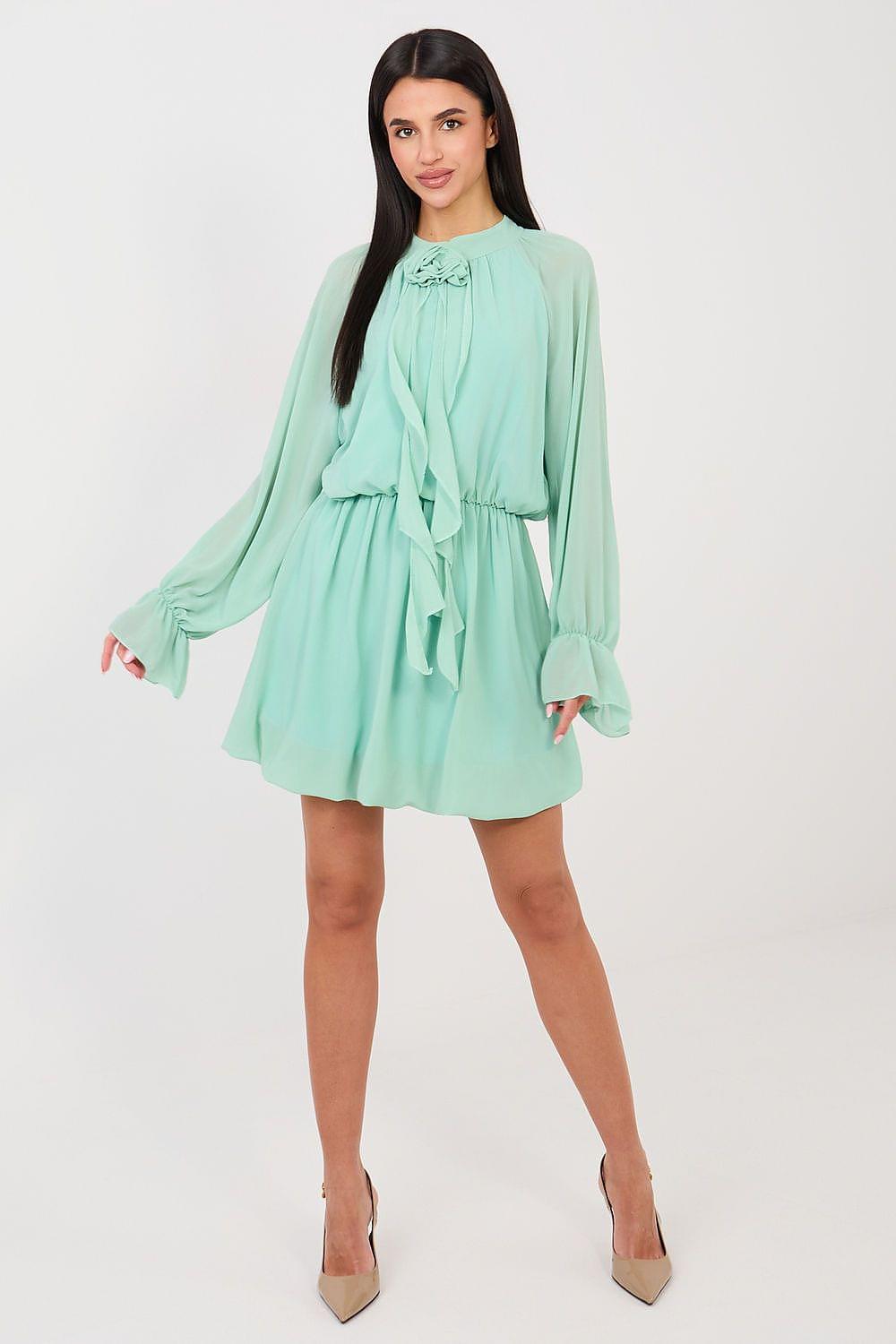 Mint green cocktail dress with ruffled neckline, tiered skirt, and long puff sleeves