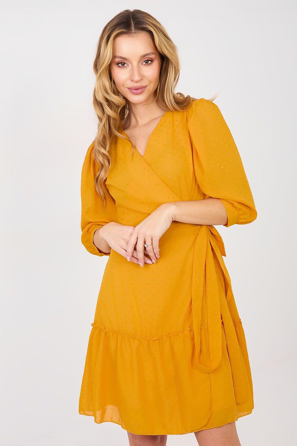 Yellow wrap-style daydress with puff sleeves and tiered skirt