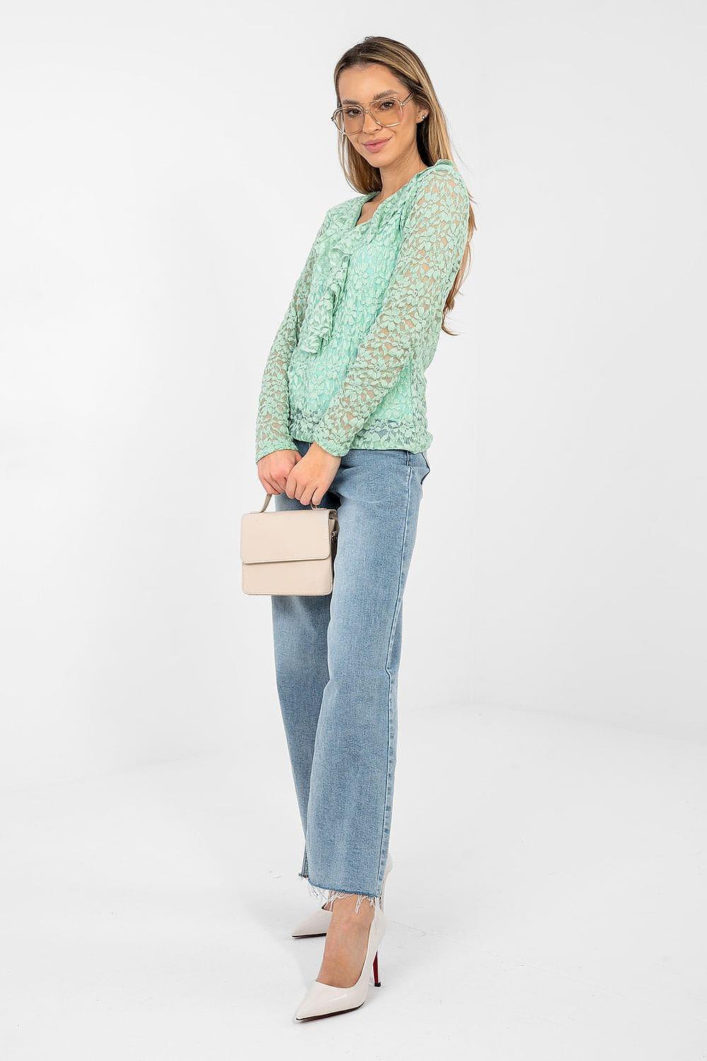 Mint green lace blouse with long sleeves and V-neck, worn with light blue jeans