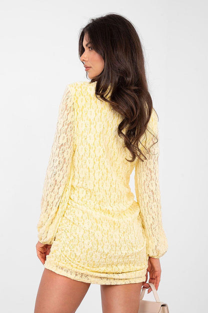 Back view light yellow textured mini dress with long sleeves and ruched hem