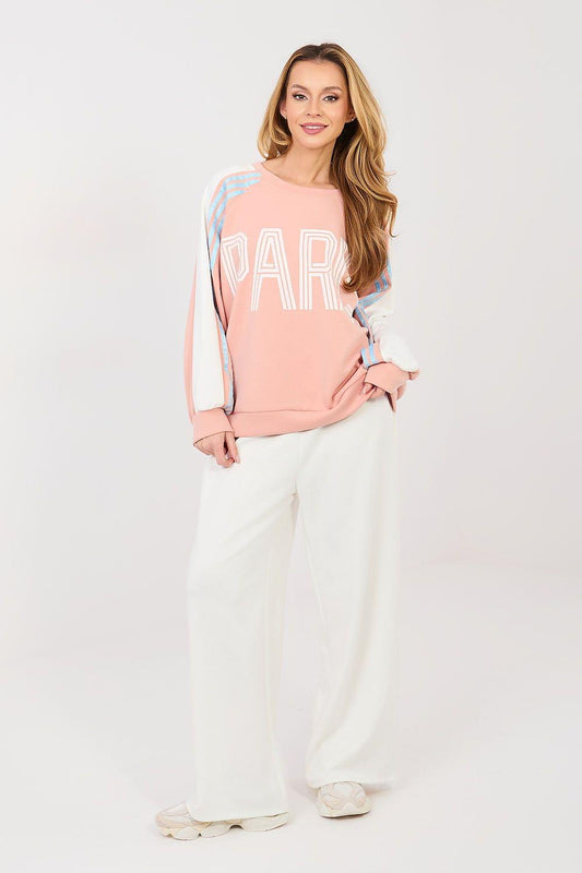Pink sweatshirt and white wide-leg pants lounge set with long sleeves and relaxed fit