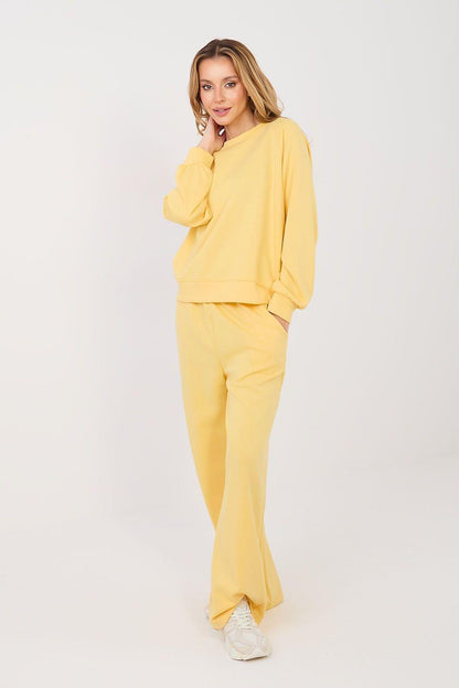 Yellow two-piece lounge set with crewneck sweatshirt and wide-leg pants