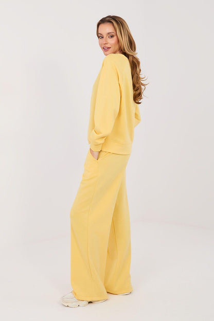Yellow wide-leg pants and crewneck sweatshirt two-piece set, side/back view