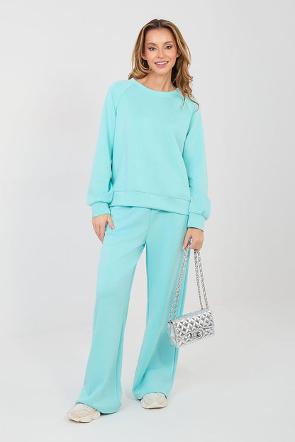Light teal two-piece lounge set with crewneck sweatshirt and wide-leg pants