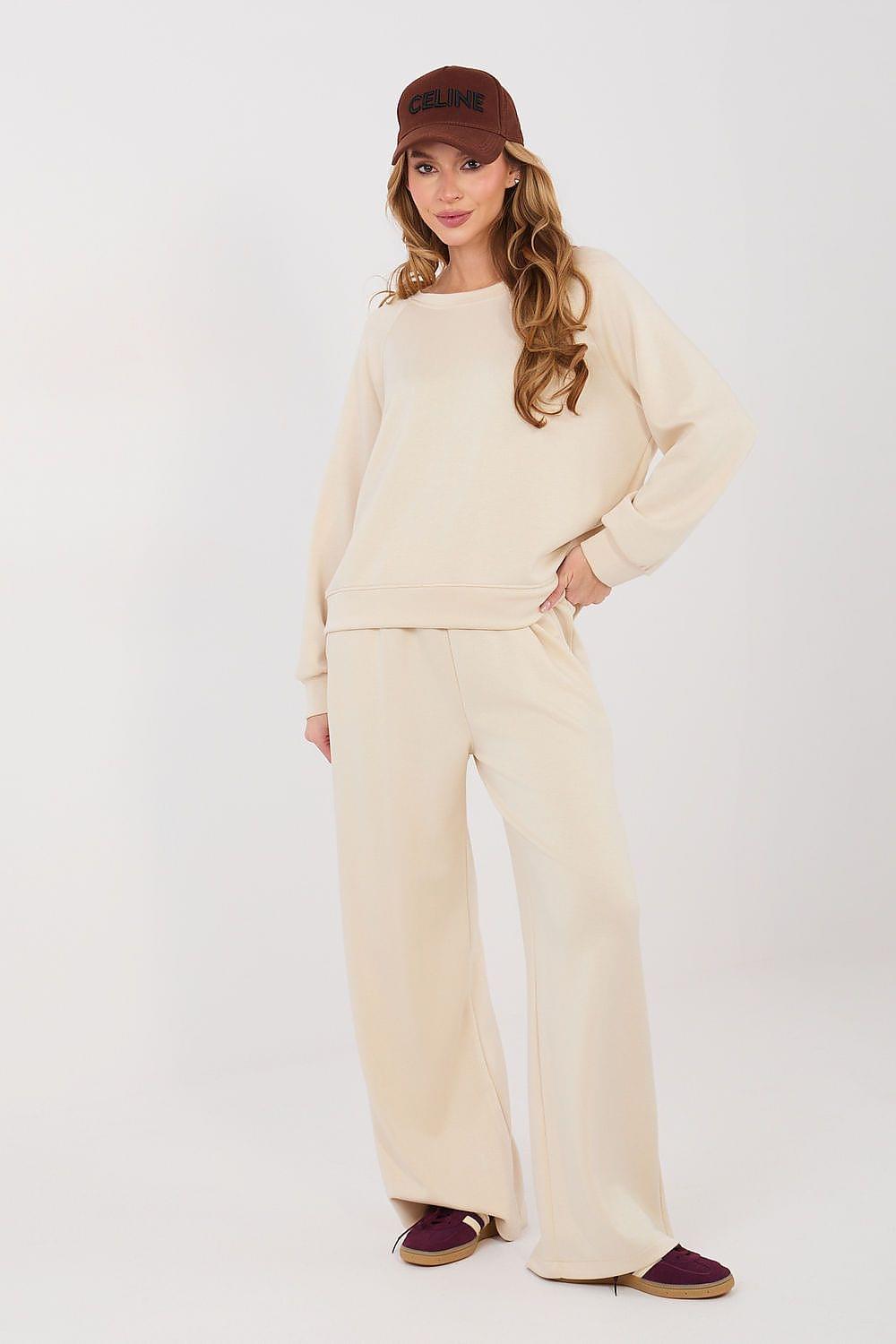 Cream long-sleeve sweatshirt and wide-leg pants set with matching drawstring waist
