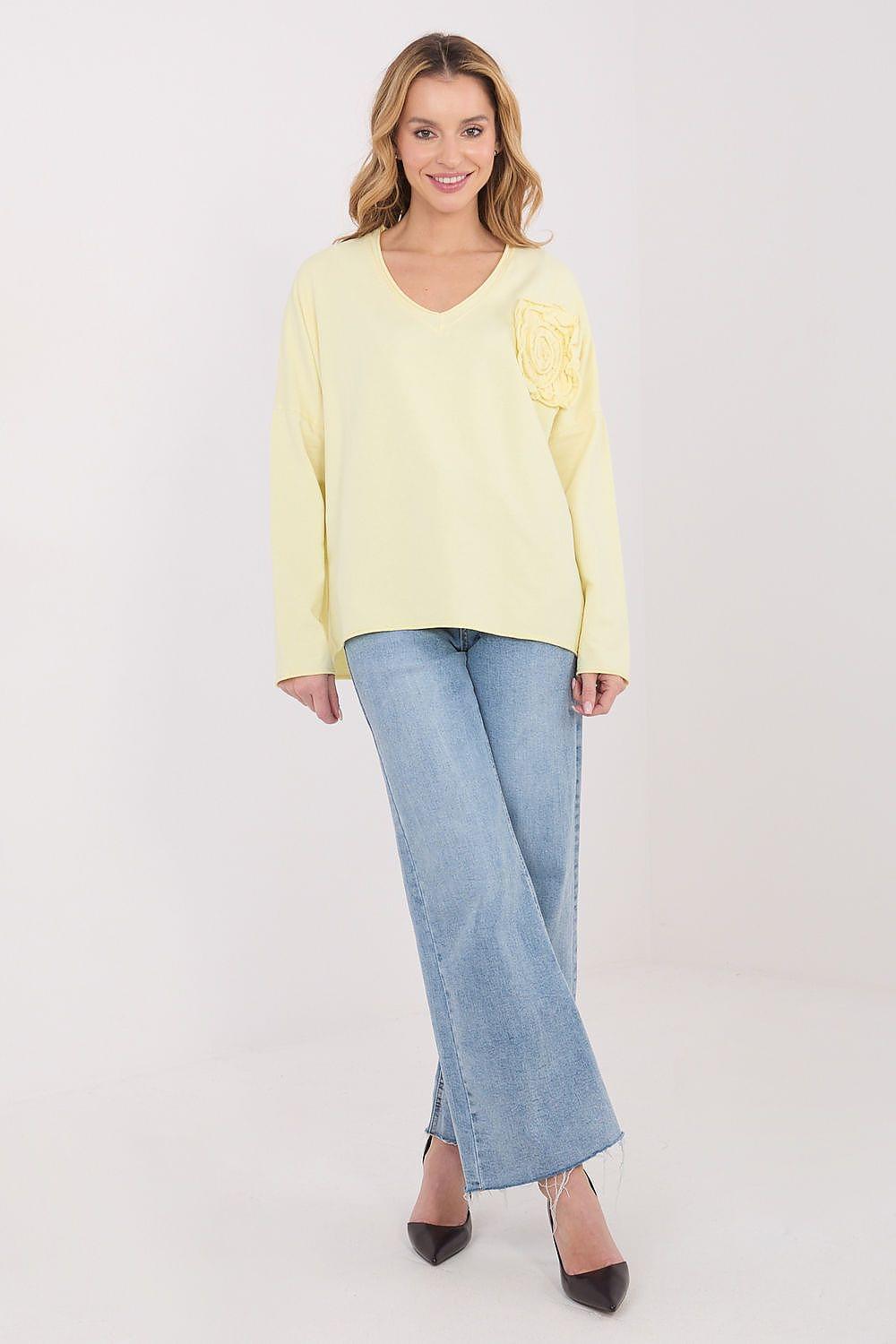 Yellow long-sleeve blouse with V-neck and embroidered rosette on left chest