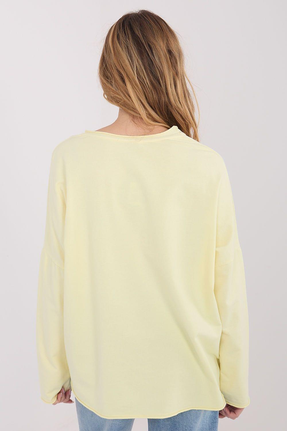 Yellow long-sleeve blouse back view with relaxed fit