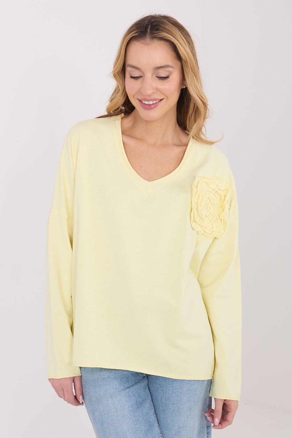 Yellow long-sleeve blouse with V-neck and flower rosette chest detail