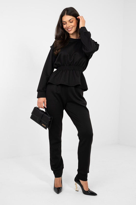 Black two-piece lounge set with ruffled peplum top and jogger pants