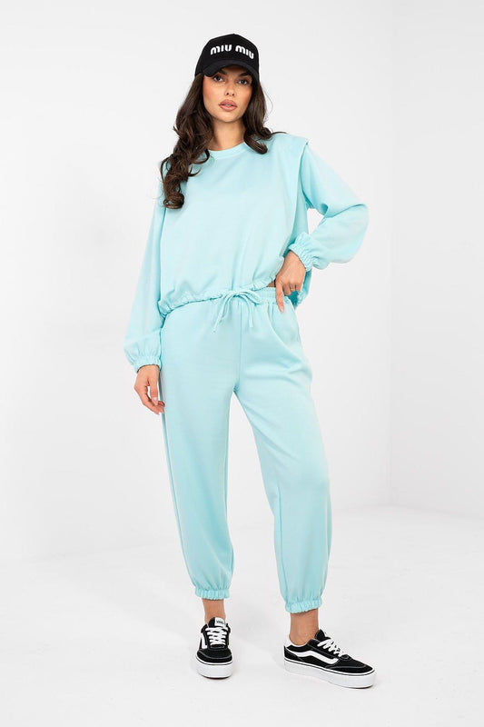 Turquoise two-piece tracksuit set with crewneck sweatshirt and drawstring joggers