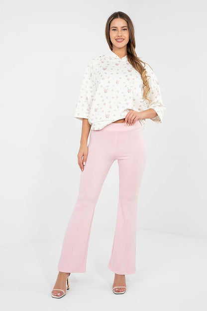 Pink wide-leg tracksuit trousers with straight flare and elastic waistband.