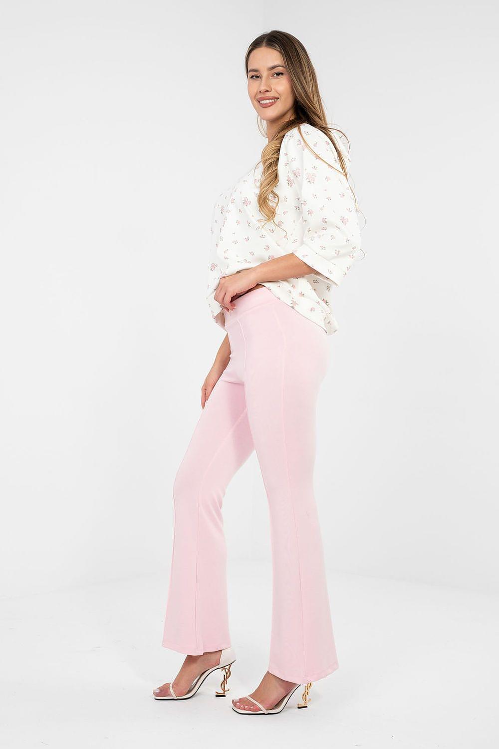 Pink flared tracksuit trousers with wide legs and elastic waistband, full length.