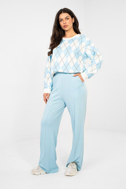 Light blue tracksuit trousers, wide-leg silhouette with elastic waistband