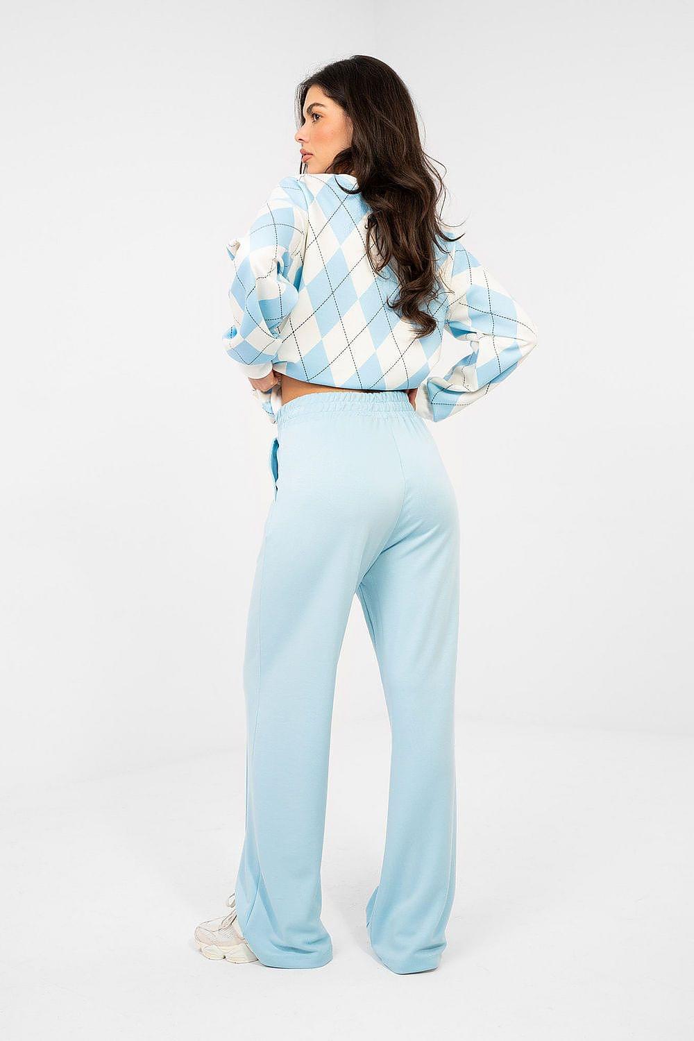 Light blue tracksuit trousers with elastic waistband, wide-leg back view