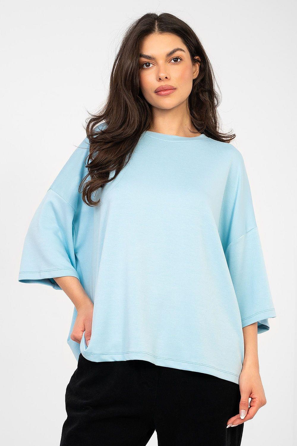 Blue blouse with crew neck and loose fit, wide short sleeves.