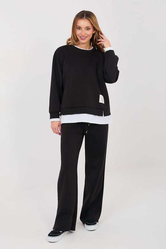 Black sweatshirt and wide-leg pants set with white contrasting cuffs and hem band
