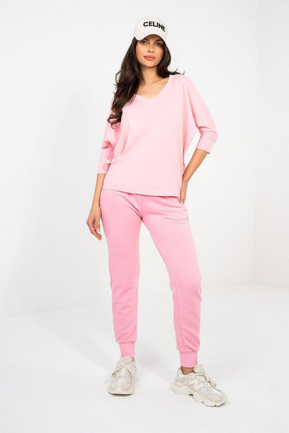 Pink V-neck blouse with 3/4 sleeves, relaxed fit