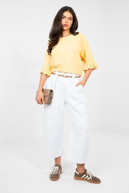 White high-waisted jeans with belted waist and cropped wide-leg legs