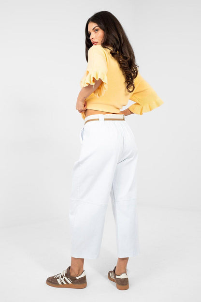 White high-waisted jeans with belted waist and cuffed cropped wide legs